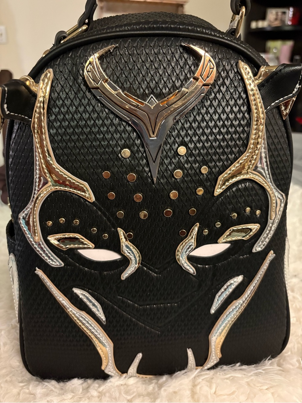 Black Men's Embossed Leather Backpack with Gold Accents